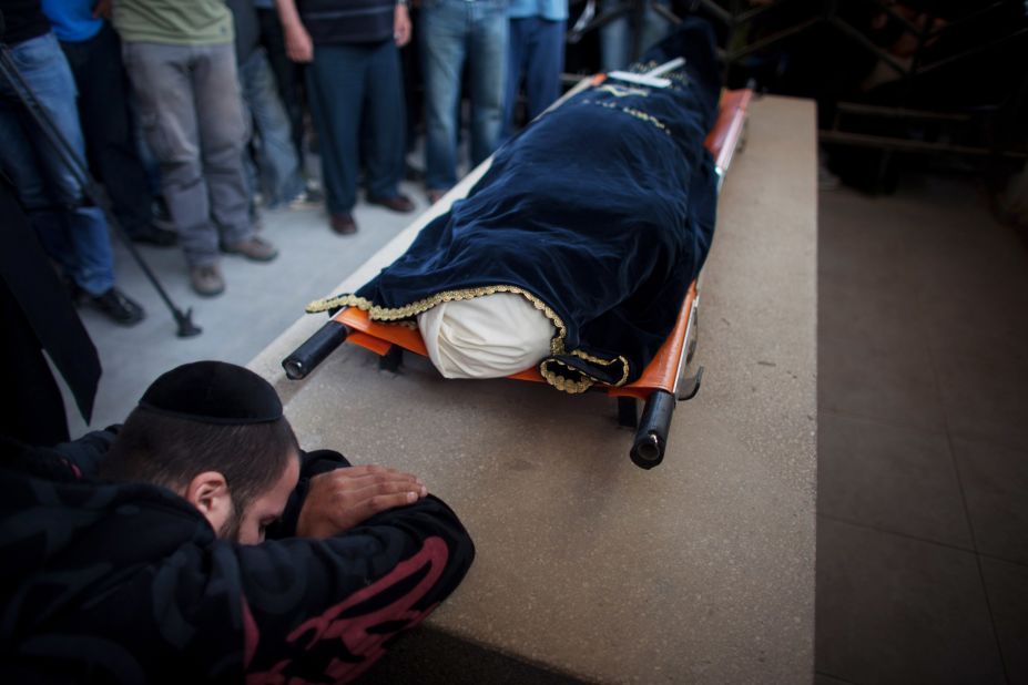 A relative grieves during the funeral for Itzik Amsalem in Kiryat Malakhi, Israel, on Friday, November 16.