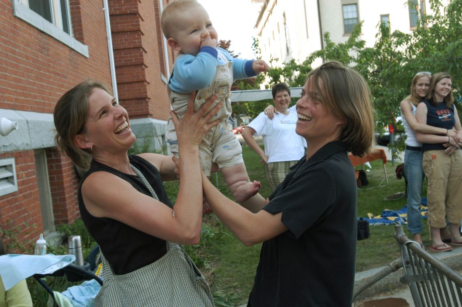 Lara Ramsey, left, and Jane Lohmann play with their 7-month-old son, Wyatt Ramsey-Lohmann. The two wed in 2004 after Massachusetts approved same-sex marriage. Massachusetts was the first state to do so.