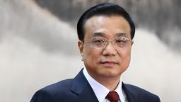 Chinese Vice Premier Li Keqiang, one of the members of new seven-seat Politburo Standing Committee, greets the media at the Great Hall of the People on November 15, 2012 in Beijing, China. China's ruling Communist Party today revealed the new Politburo Standing Committee after its 18th congress. 