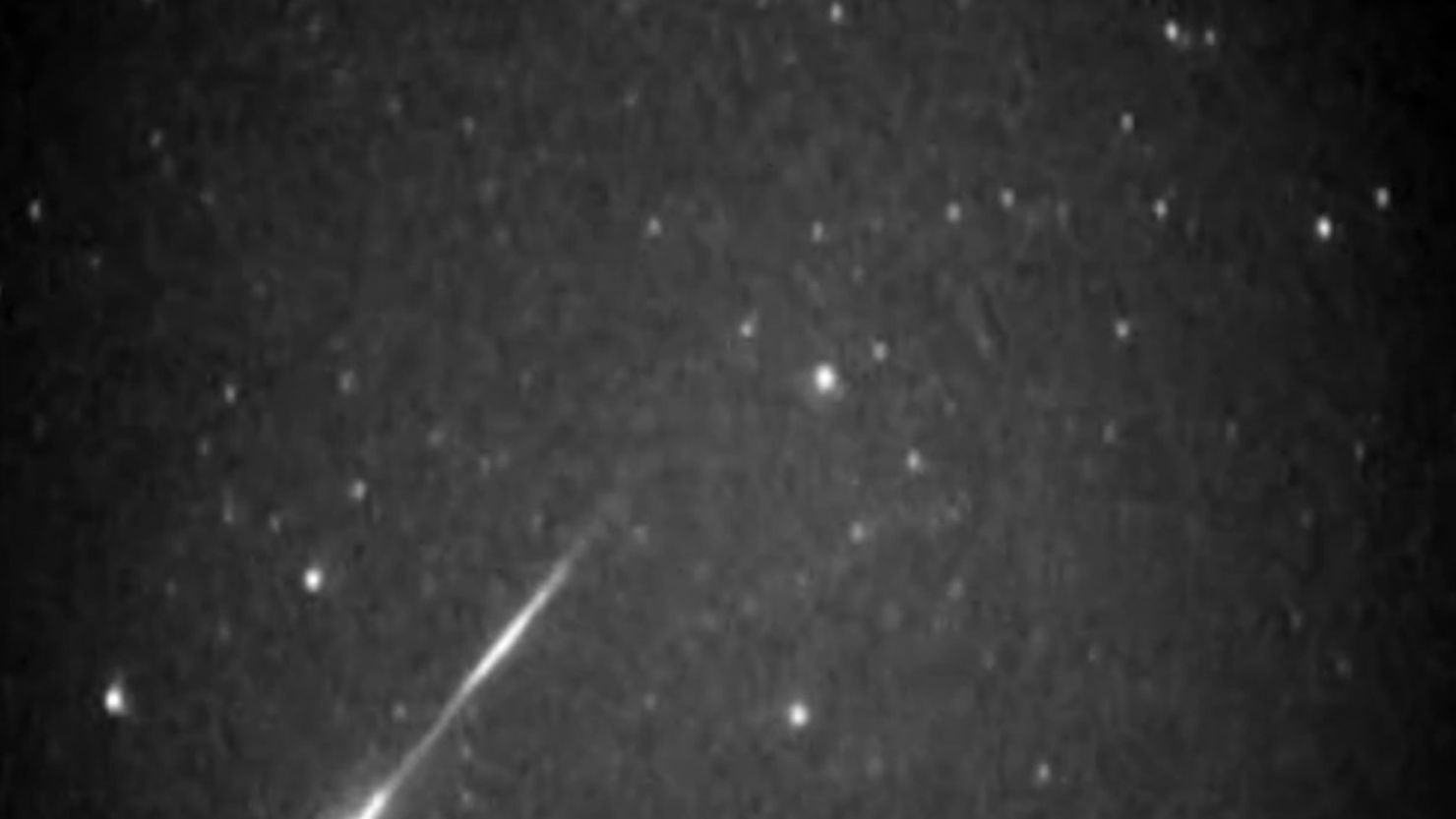 A meteor from the Leonid meteor shower streaks across the sky.