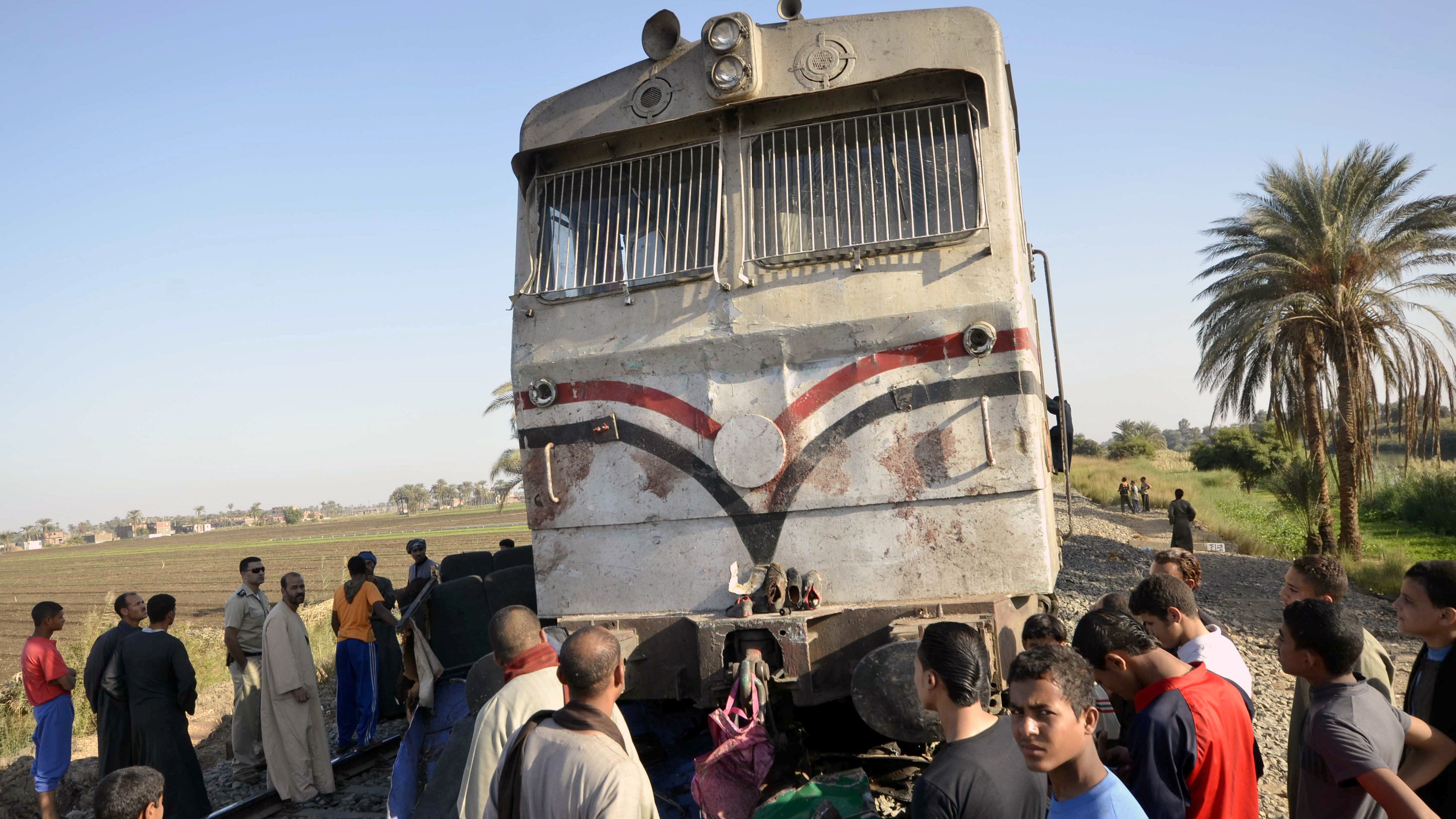 Egyptians inspect the damage caused by train accident in the province of Assuit, south of Cairo on November 17.