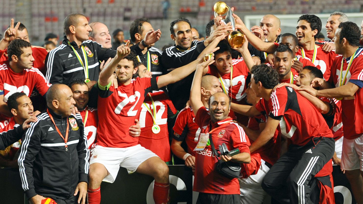 Egypt's Al-Ahly team pose with the African Champions League trophy after winning 2-1 against Esperance de Tunis.