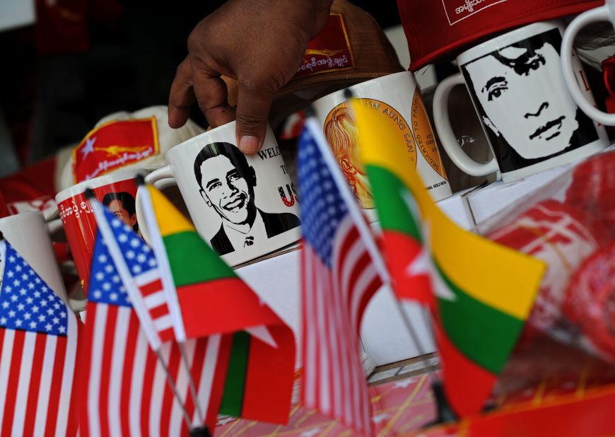 Cups printed with pictures of US President Barack Obama and Myanmar opposition leader Aung San Suu Kyi are displayed at a shop in downtown Yangon on Saturday.