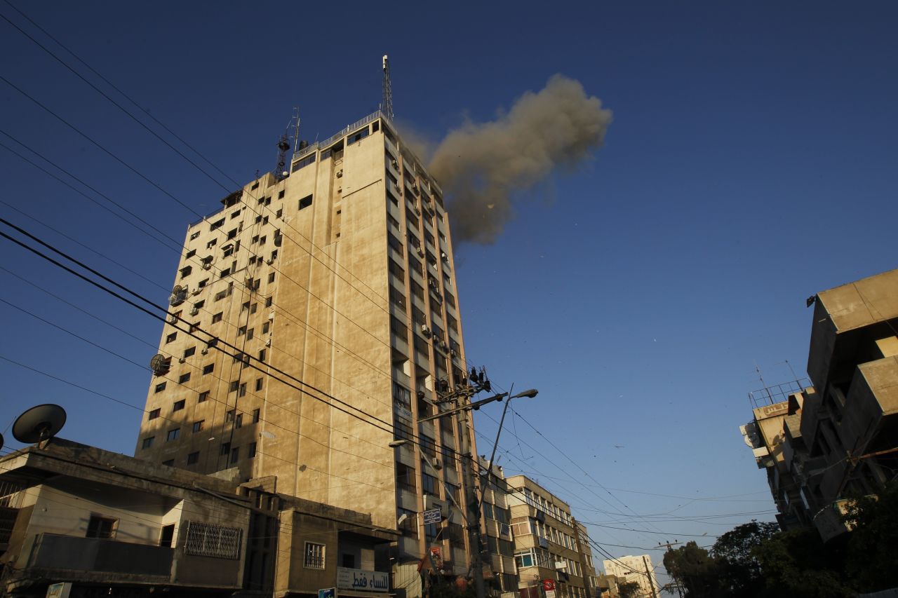 Smoke rises after an Israeli air strike on an office of Hamas television channel Al-Aqsa in the southern Gaza town of Rafah on Sunday, November 18. Israeli warplanes hit the Gaza City media center and homes in northern Gaza in the early morning.