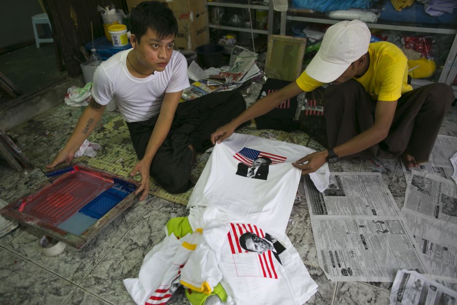 Two men silk-screen Obama T-shirts at a shop in Yangon on Sunday in preparation for Obama's visit.