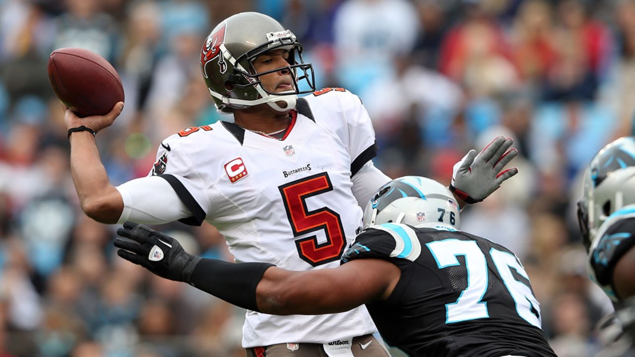 Greg Hardy of the Panthers hits Josh Freeman of the Buccaneers as he throws a pass on Sunday.