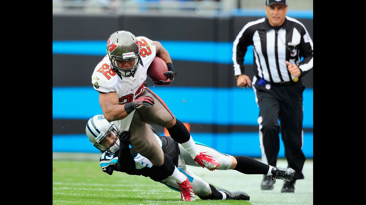 Haruki Nakamura of the Panthers tackles Doug Martin of the Buccaneers on Sunday.