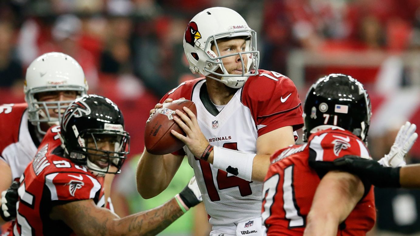 Ryan Lindley of the Cardinals looks to pass against the Falcons before fumbling the ball from pressure by John Abraham and Kroy Biermann at Georgia Dome on Sunday.