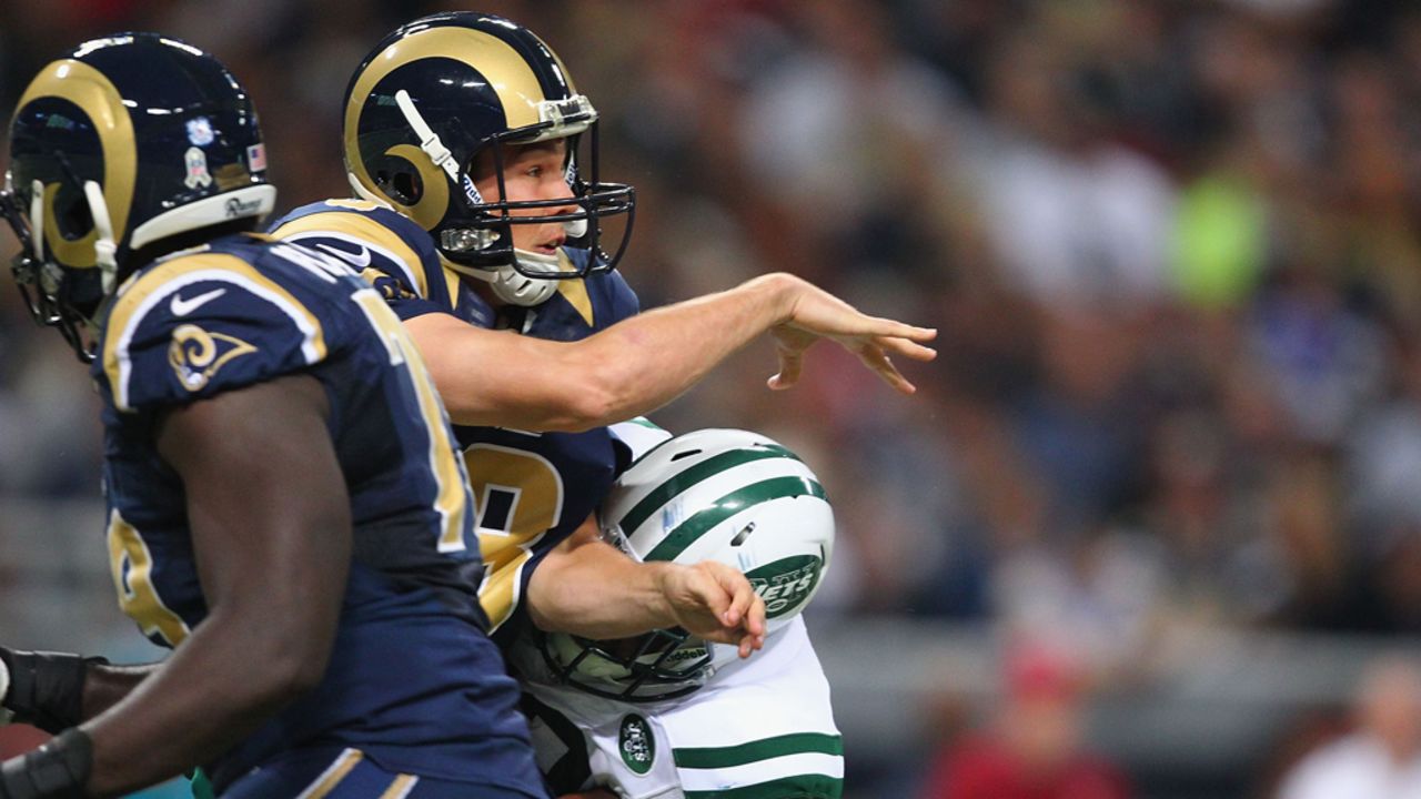 Sam Bradford of the St. Louis Rams is hit after passing the ball against the New York Jets at the Edward Jones Dome on Sunday in St. Louis. 
