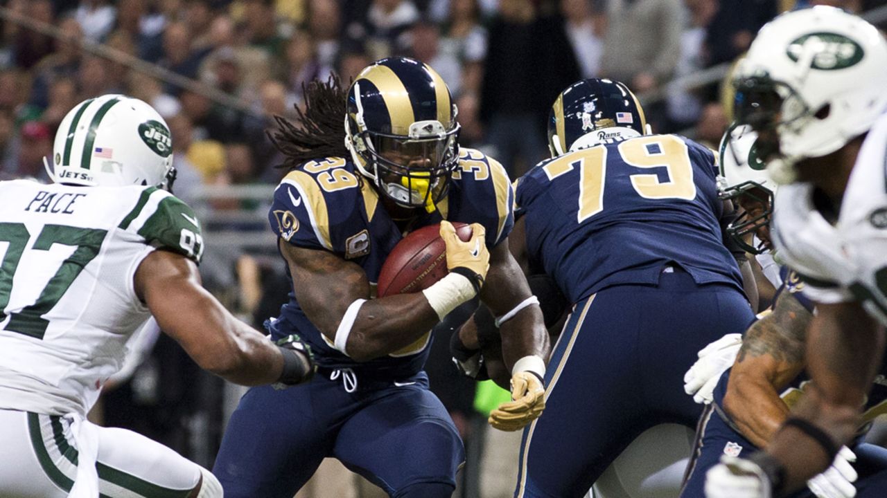 Running back Steven Jackson of the Rams runs up the middle during the game against the Jets on Sunday.