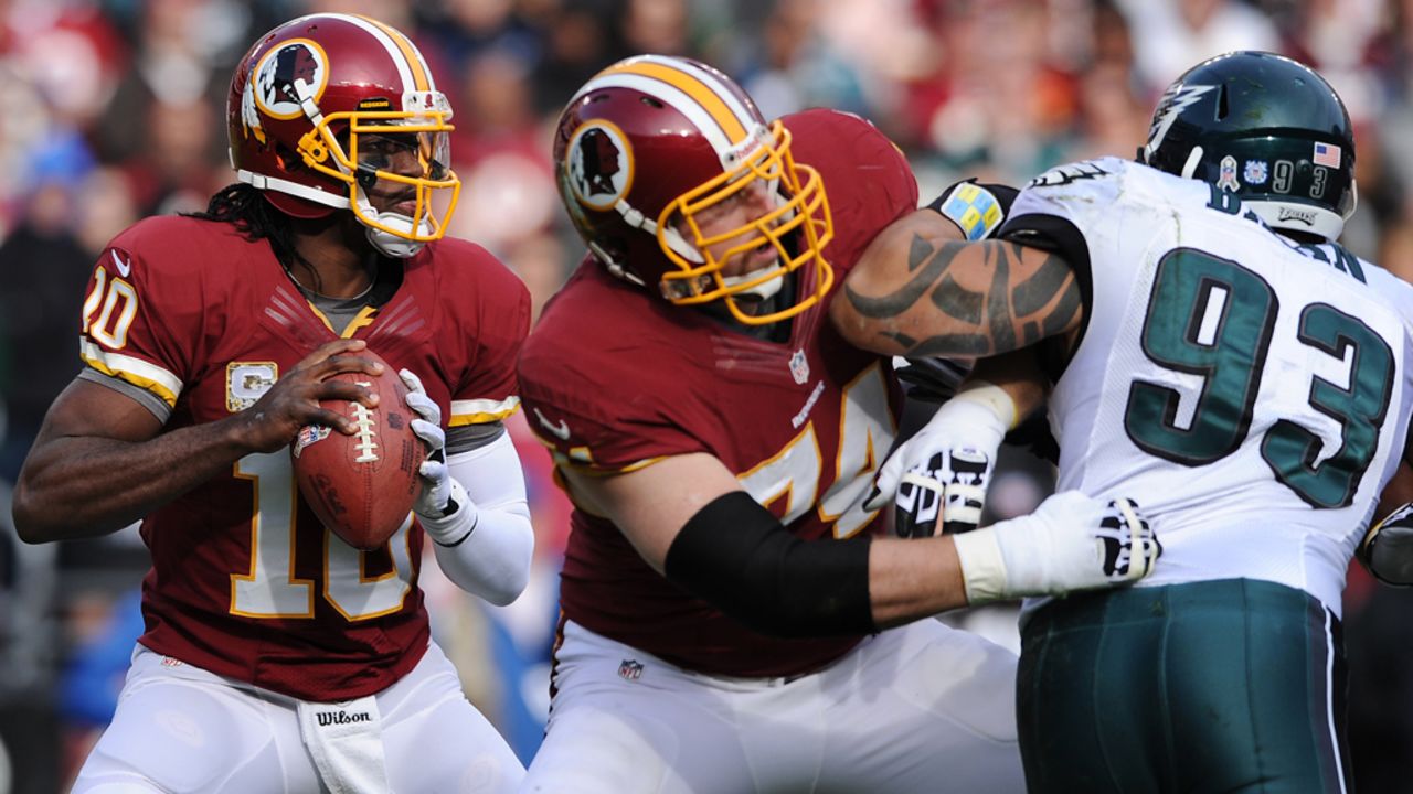 Quarterback Robert Griffin III of the Redskins looks to pass against the Eagles in the second quarter on Sunday.