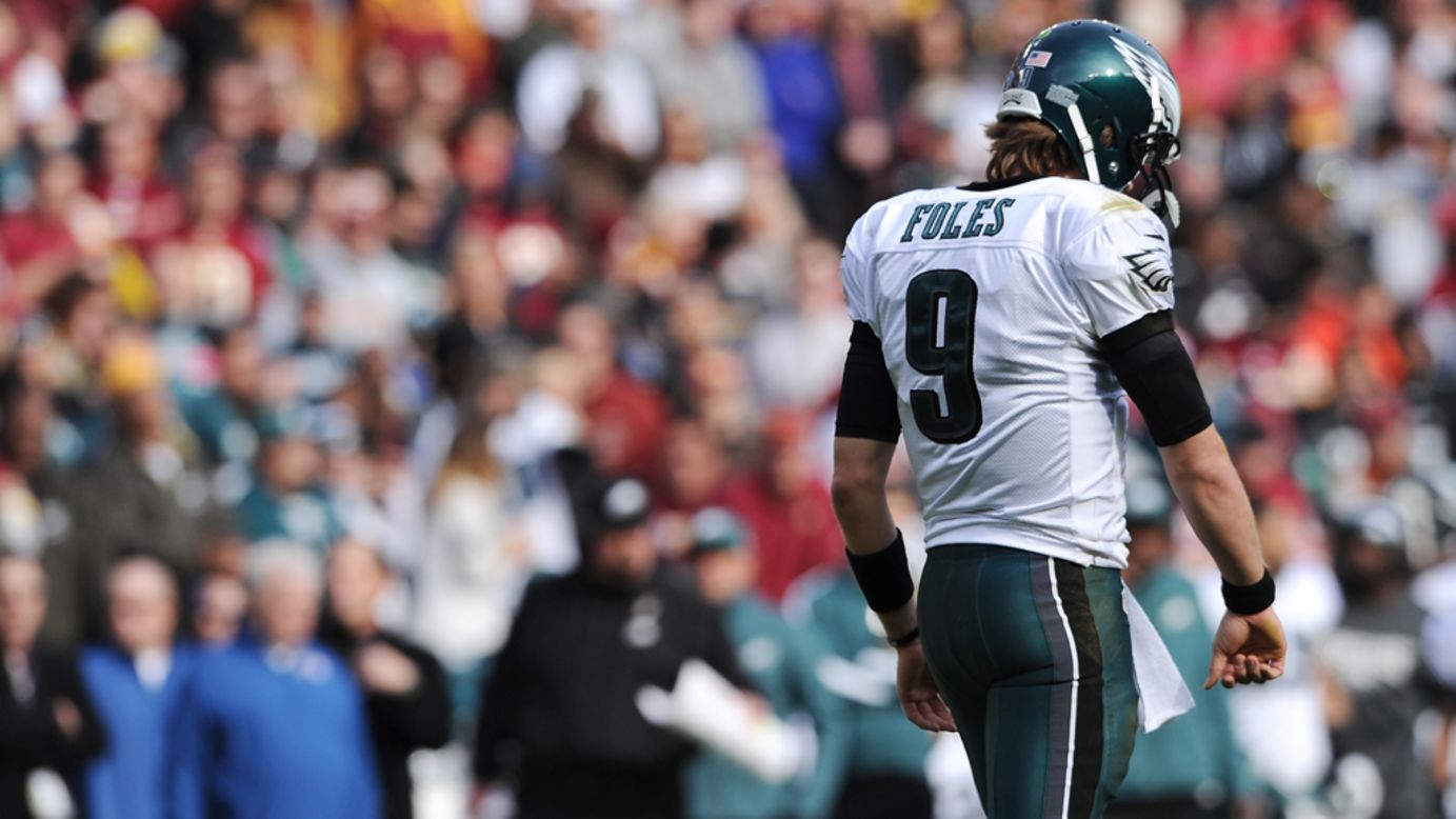 Quarterback Nick Foles of the Eagles walks off the field after an incomplete pass against the Redskins in the first quarter on Sunday.