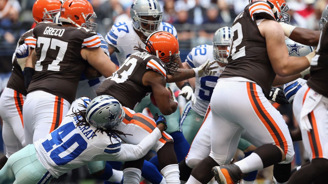 Trent Richardson of the Browns runs the ball against Danny McCray of the Cowboys on Sunday.