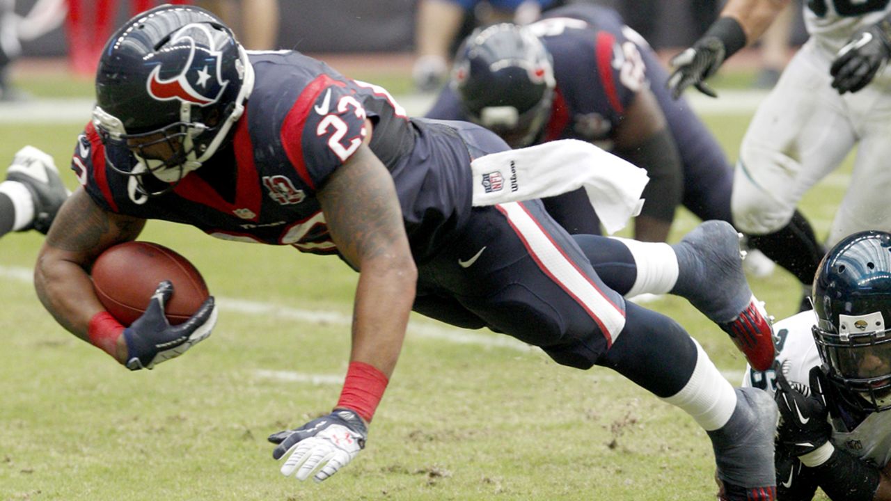 Arian Foster of the Texans rushes against the Jaguars on Sunday.