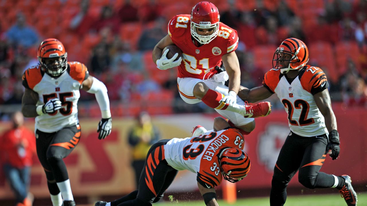 Tight end Tony Moeaki of the of the Chiefs leaps over defenders No. 33 Chris Crocker and No. 22 Nate Clements of the Bengals in route to a first down during the first half on Sunday.