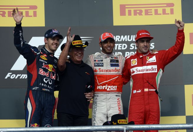 Hamilton's victory means Fernando Alonso (right) can still pip reigning world champion Sebastian Vettel (left) for the title in the final race in Brazil, with one of America's former F1 champs, Mario Andretti, also soaking up the adulation on Sunday. 