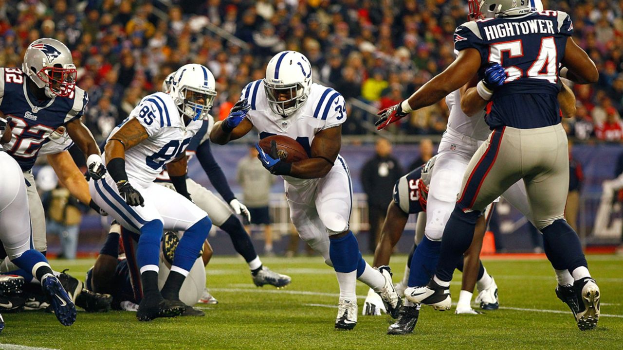 Delone Carter of the Colts runs in for a touchdown on their first drive in the first quarter against the Patriots on Sunday.