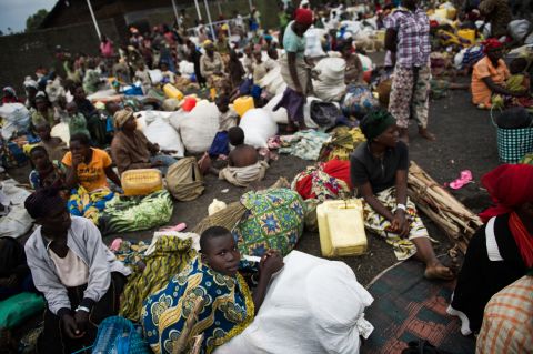 Displaced Congolese sit inside a United Nations base in Monigi, 5km from Goma, as they seek shelter after being forced to flee a temporary camp, on November 18, 2012.