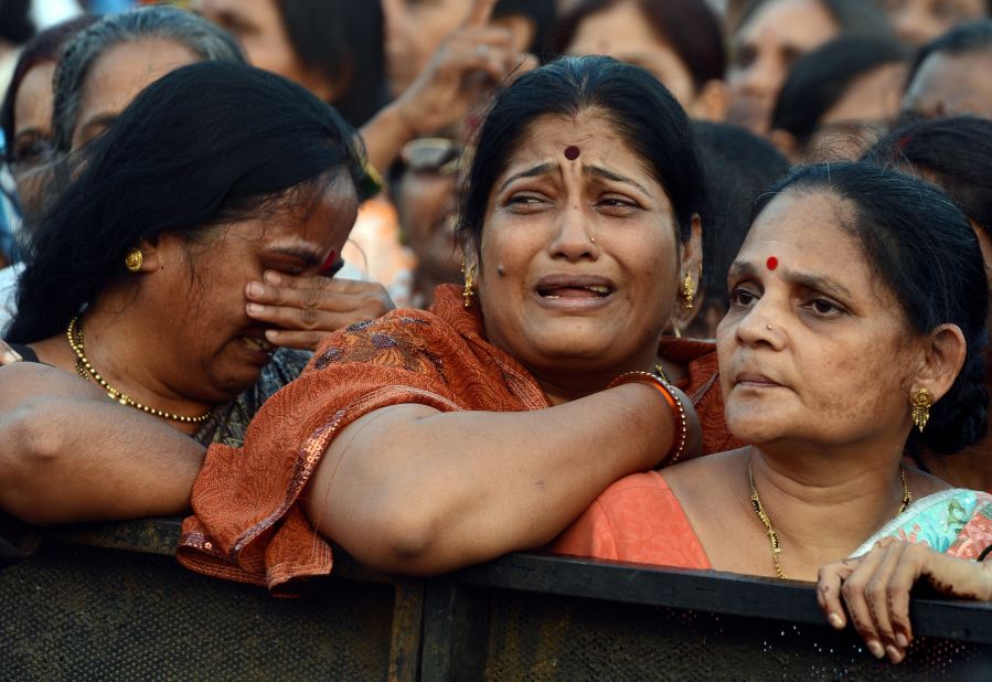 Women weep during the funeral of Bal Thackeray.
