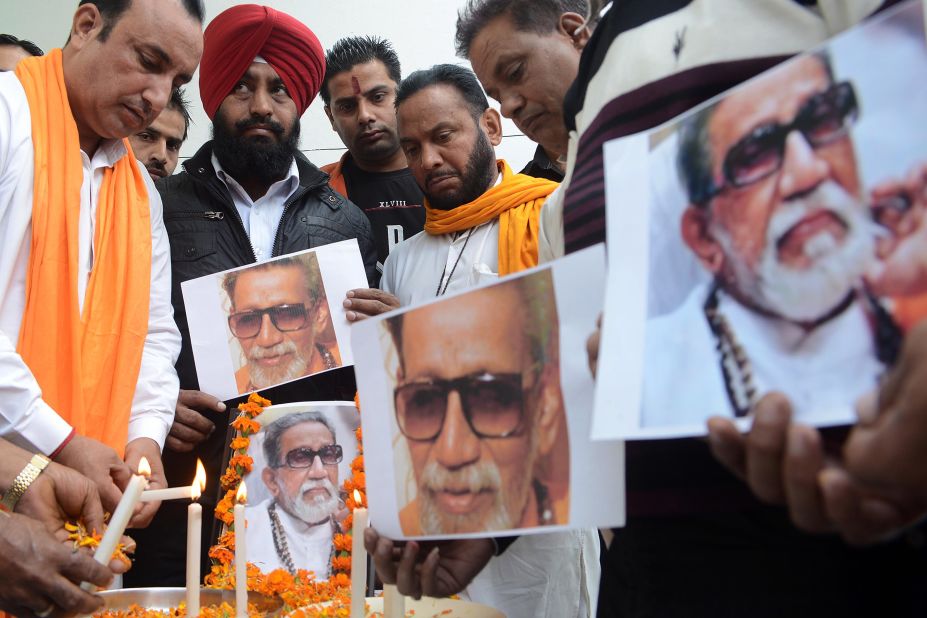 Members of the Indian Hindu nationalist Shiv Sena party light candles as they pay tribute to party founder and chief, Bal Thackeray in Amritsar on Sunday.  