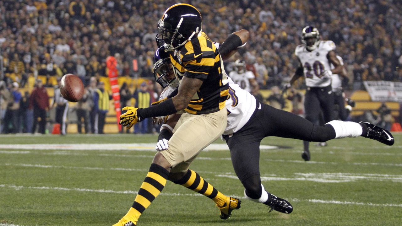 Chykie Brown of the Baltimore Ravens is called for pass interference against Mike Wallace of the Pittsburgh Steelers during Sunday night's game.