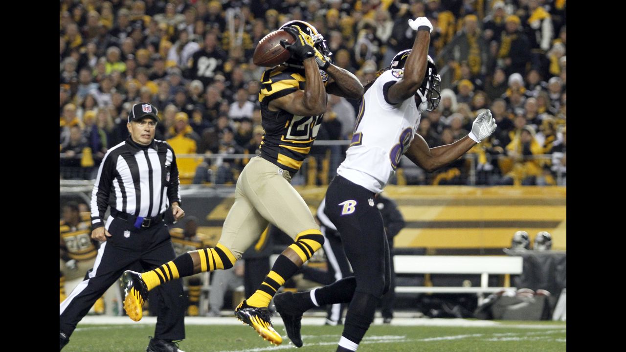 Ike Taylor of the Pittsburgh Steelers breaks up a pass intended for Torrey Smith of the Baltimore Ravens.