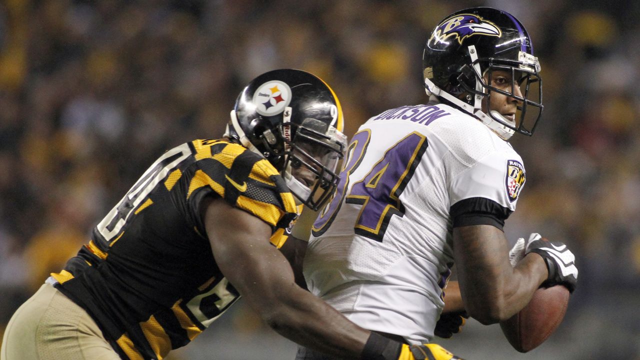 Ed Dickson of the Baltimore Ravens makes a catch against Lawrence Timmons of the Pittsburgh Steelers.