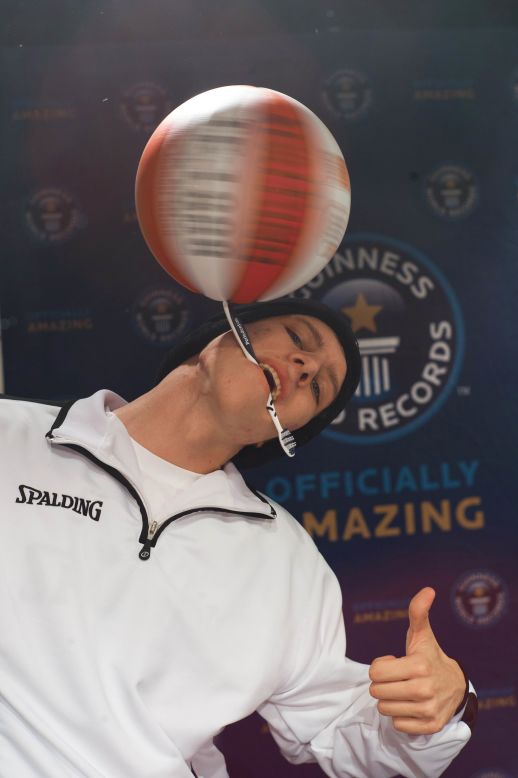 Can you spin a basketball? How about spinning a basketball on a toothbrush? Which you hold in your mouth? Michael Kopp set the world record for longest duration spinning a basketball on a toothbrush -- 26.078 seconds -- in Hamburg, Germany on November 14. 