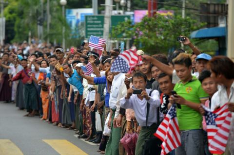 Local residents wait in anticipation as Obama's motorcade drives to the Parliament House in Yangon.