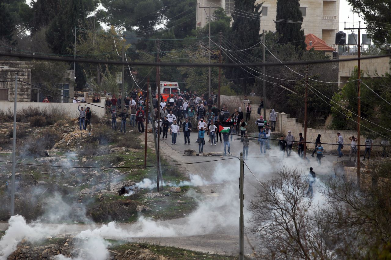 Birzeit University students clash with Israeli soldiers on Monday.