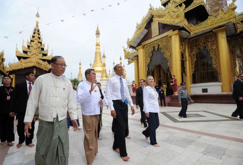 U.S. President Obama (3rd L) and U.S. Secretary of State Hillary Clinton (front R) are escorted around the grounds as they visit the Shwedagon pagoda in Yangon on Monday.