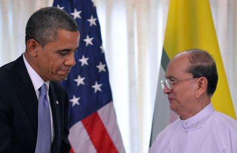 U.S. President Obama shakes hands with Myanmar's President Thein Sein in Yangon on Monday.