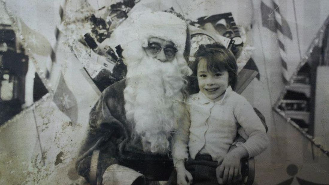 A child sits on Santa's lap in this damaged photograph, found in Union Beach after Sandy swept through.