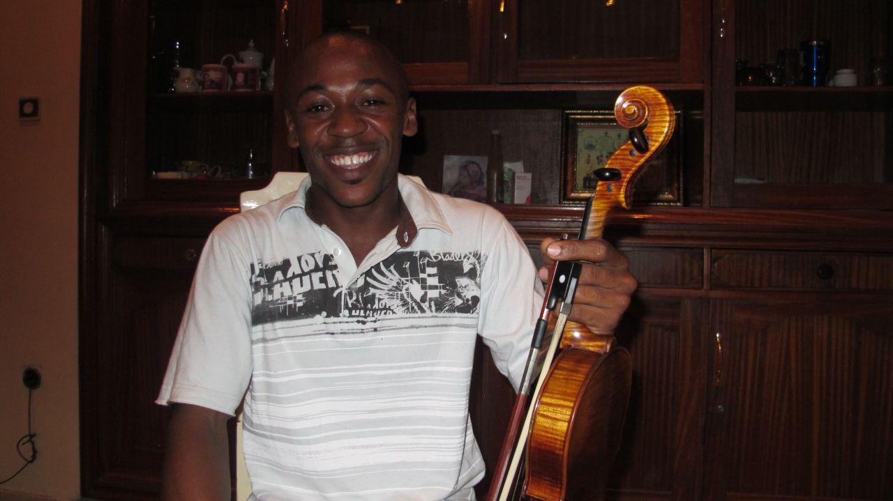 Rodrick Muamba joins rehearsals after work and aspires to become a world-renowned violinist