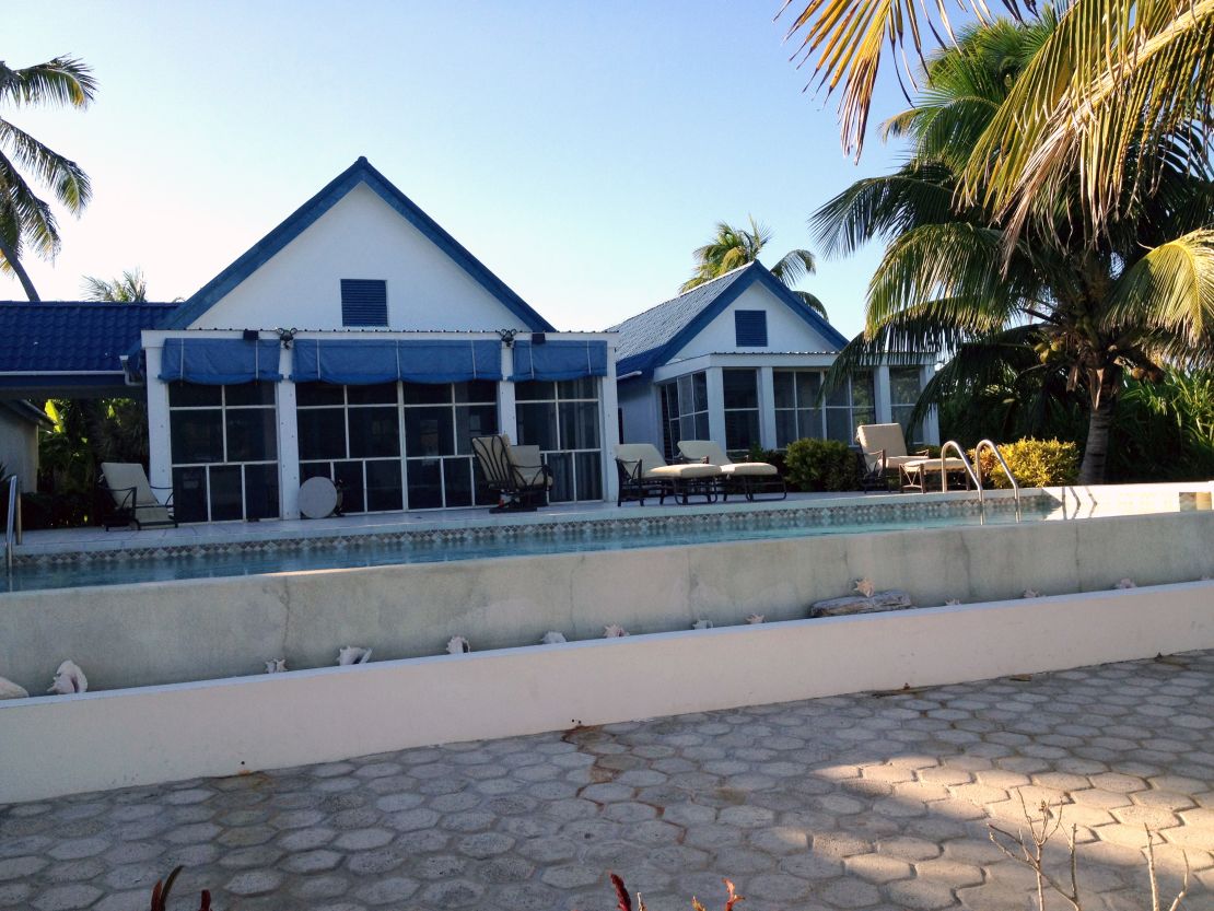 John McAfee shares his home in Belize with seven girlfriends, two women told CNN.