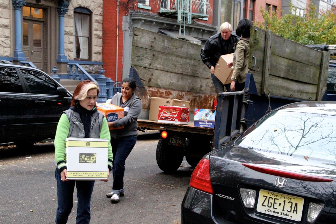 Volunteers carry supplies to a grass-roots relief hub for Superstorm Sandy's victims in Jersey City, New Jersey.