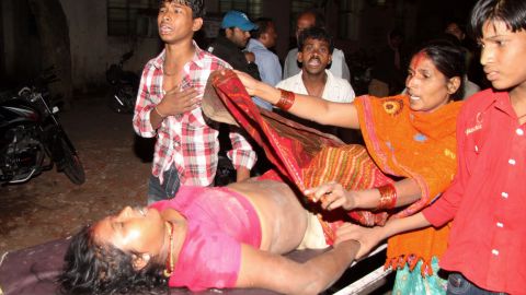 A victim of the stampede is rushed to the hospital after a bridge collapsed along the banks of the Ganges River on Monday.