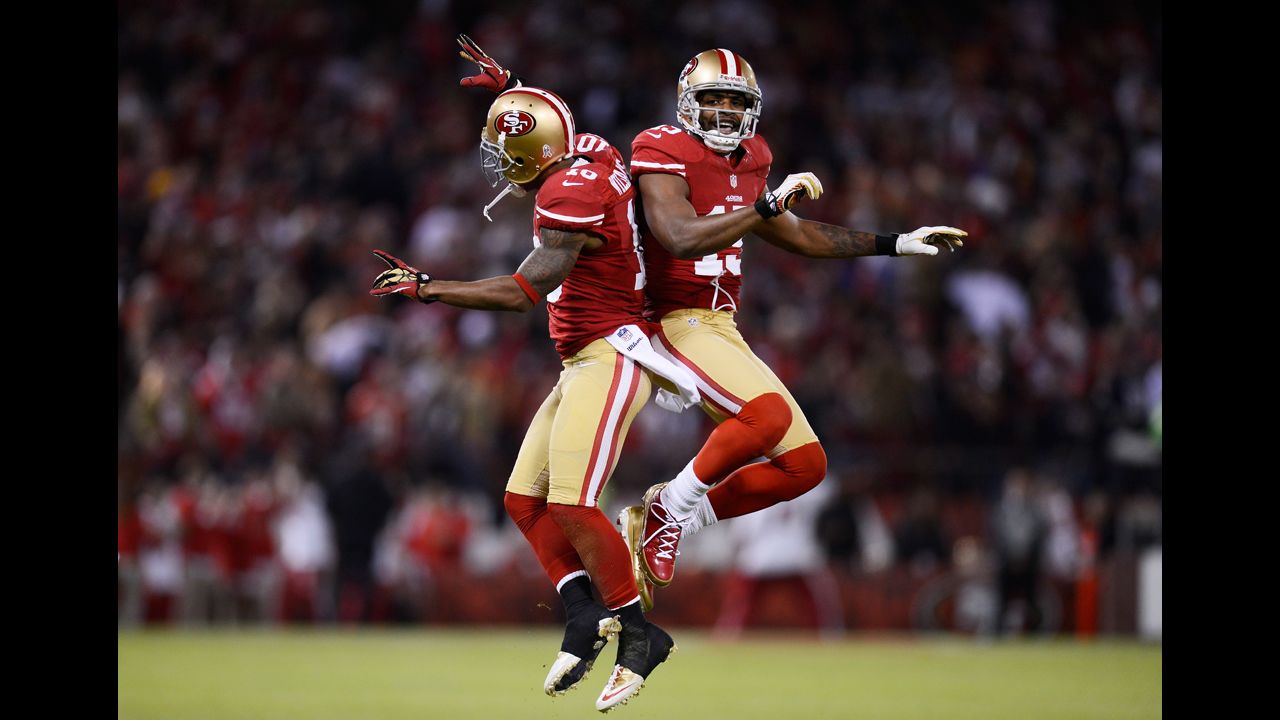 Kyle Williams, left, and  Michael Crabtree of the San Francisco 49ers celebrate a reception by Williams in the first quarter of Monday's game against the Chicago Bears.