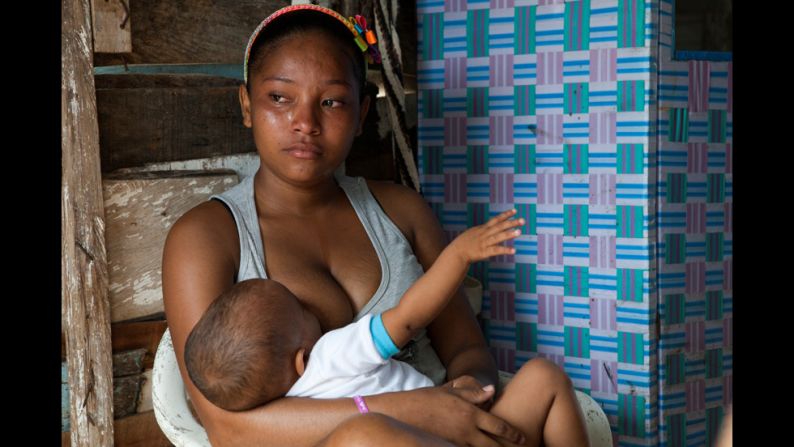 A teenage mother cries while discussing her living conditions. The Colombian government reports that nearly 20% of girls between 15 and 19 years old are or have been pregnant -- nearly triple the U.S. rate. In Cartagena, where one-third of residents live at or below the poverty line, young mothers have very little chance of improving their lives.