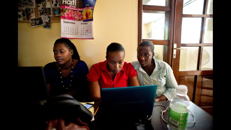 Workers carry out administrative duties at the KOFAVIV center. All of KOFAVIV's employees have been affected by gender-based violence, whether personally or through a family member or loved one, Villard-Appolon said.
