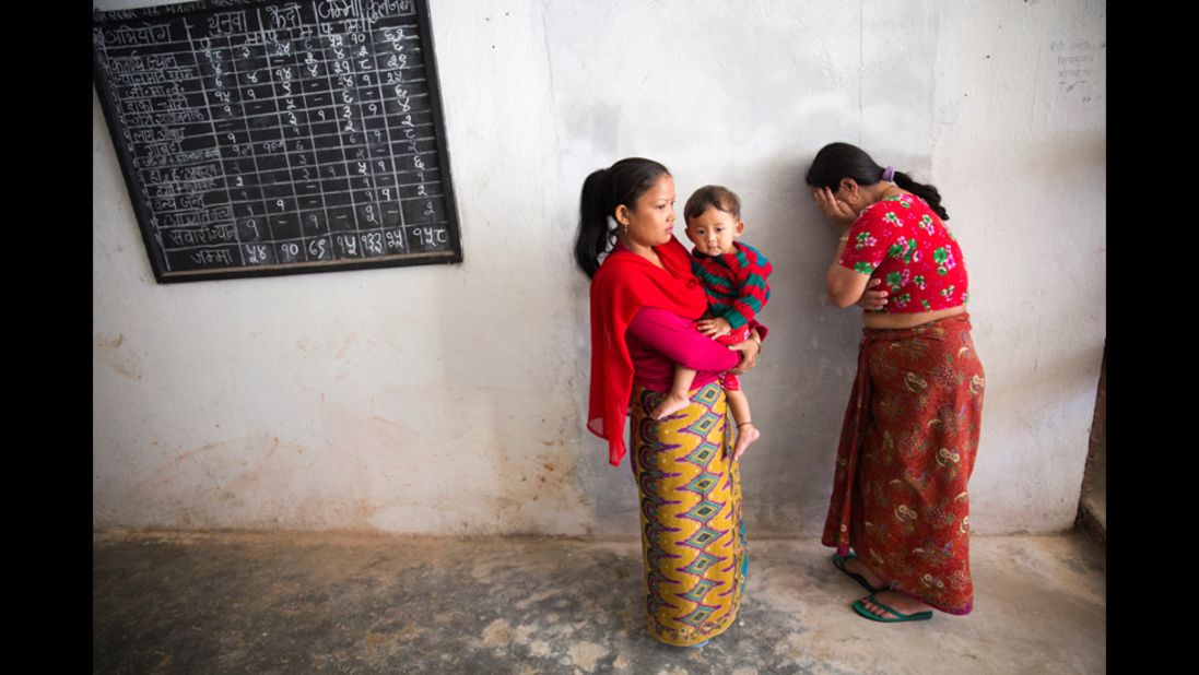 A woman at a prison in the town of Nuwakot cries after sending her child away with Basnet. Basnet wants the children to maintain relationships with their parents, so she often takes them back to visit. Ultimately, the goal is to reunite the families outside prison.