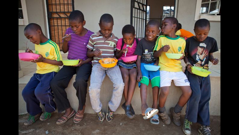 At 2 p.m., when students flood through the gates after school, everyone gets a hot meal.