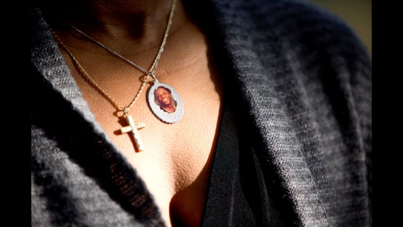 A photo of Josh hangs from Butts' neck. Josh drowned in 2006 while rafting on a lake with friends. The 16-year-old didn't know how to swim, and he wasn't wearing a life jacket, Butts said.