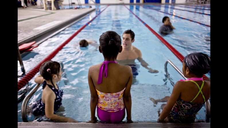 Children listen to their instructor during lessons at the high school.