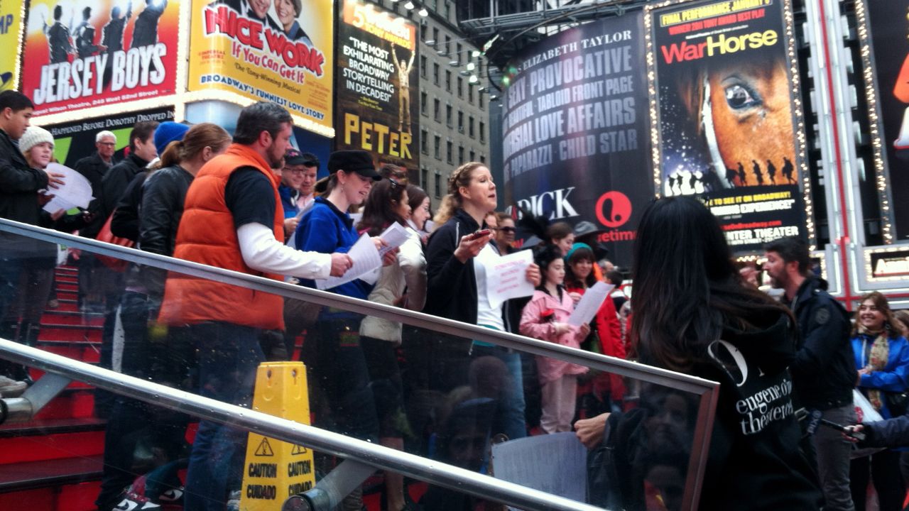 Look at all these people singing in Times Square. So much niceness. What gives, New York?