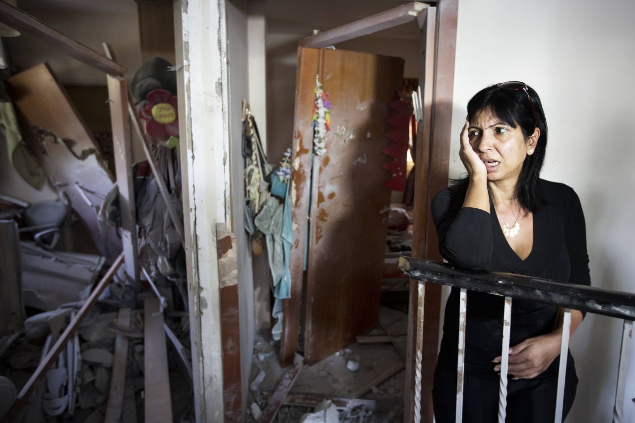 Ronit Hakmon reacts to the damage to her home in Beer Sheva, Israel, on Tuesday, after a rocket from Gaza militants hit it.