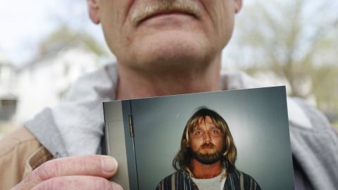 Clay Rogers holds a photo of his brother Glen Rogers, who is awaiting execution in Florida.