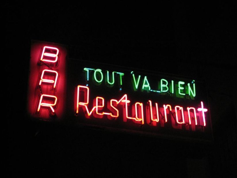 Tout Va Bien Restaurant on West 51st St. in Manhattan is marked with a circa 1955 Midtown Neon Sign Corp. creation.