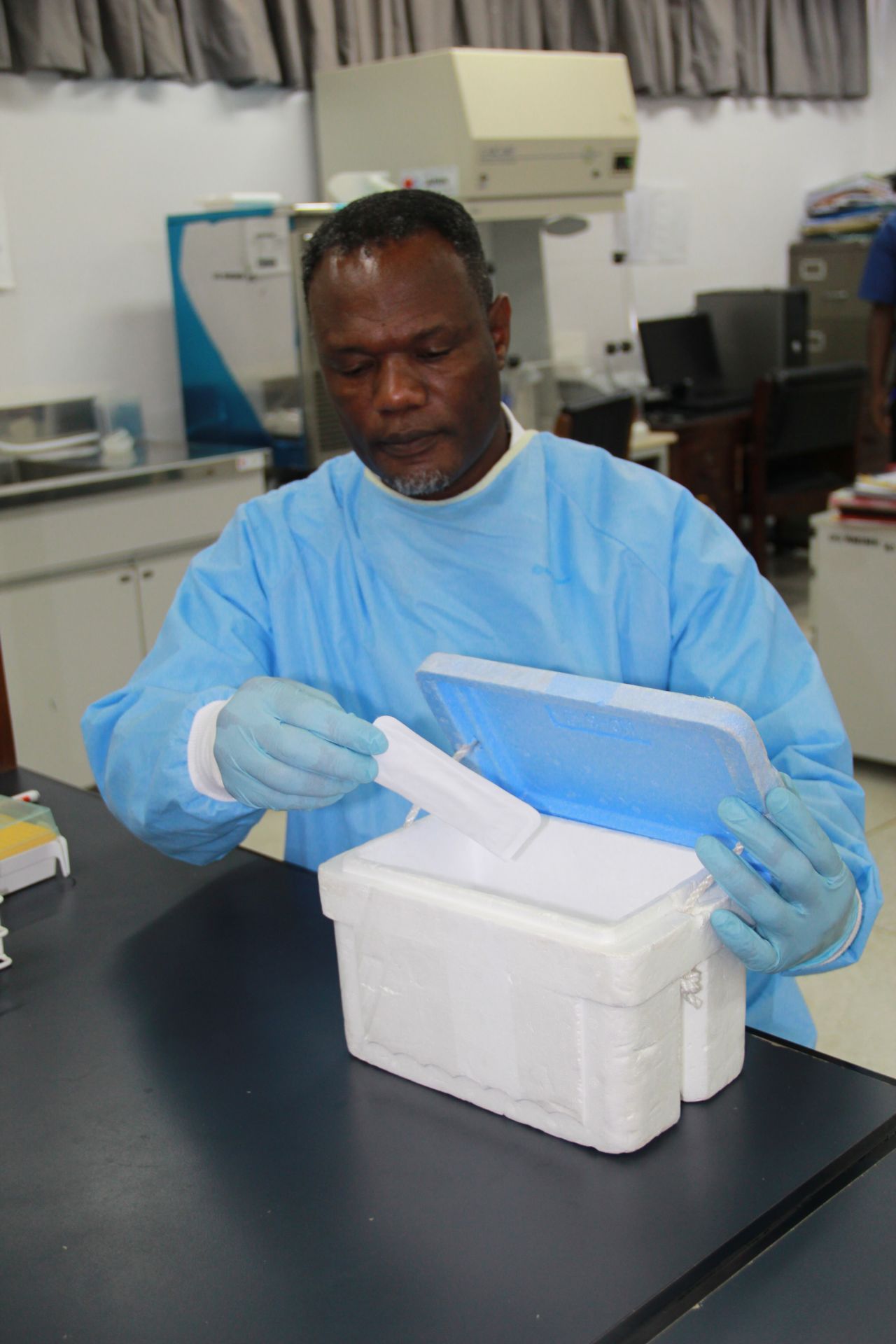 Dr. Anthony Ablordey handles a point-of-care test sample in a lab at the University of Ghana. The test aims to provide rapid and accurate detection of the Buruli ulcer disease in poor places.