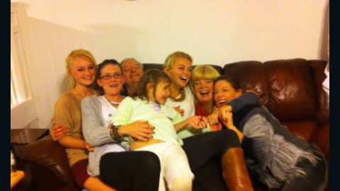 Family and friends pile on the couch at the so-called 'Douglas Family Compound.'